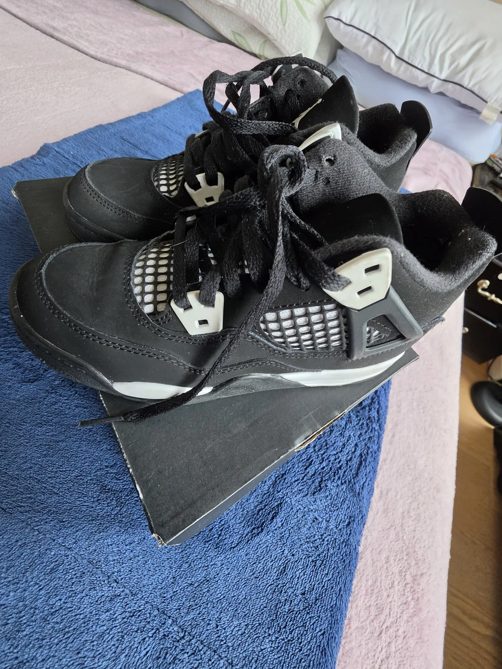 Nike Air Jordan 4 Kids Black and White Lace-Up Sneakers